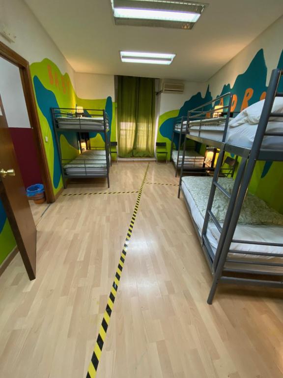 A bed or beds in a room at Bed Madrid Rooms by Bossh! Hotels
