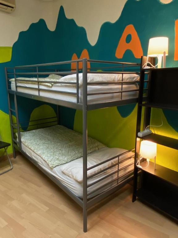 A bed or beds in a room at Bed Madrid Rooms by Bossh! Hotels