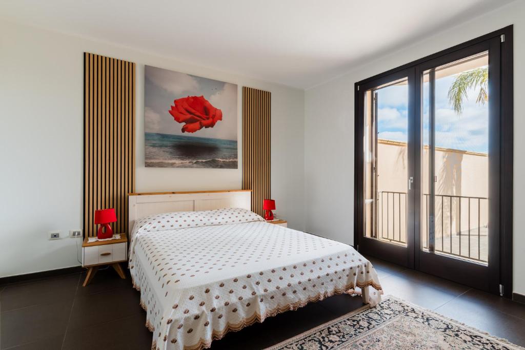 Postel nebo postele na pokoji v ubytování Intera villa ad uso esclusivo con 2 bagni 4 camere da letto,garage,giardino,area fitness,lavatrice,wifi