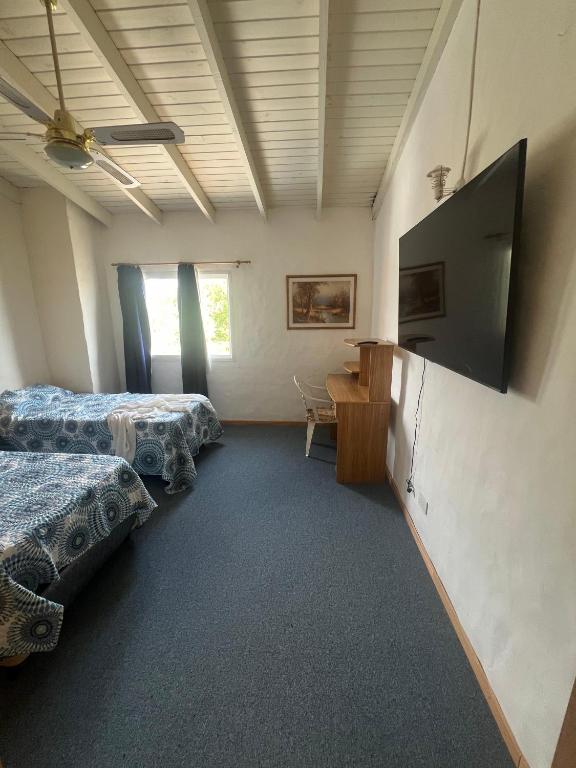 Televiisor ja/või meelelahutuskeskus majutusasutuses Duplex 4pax Playa Unión