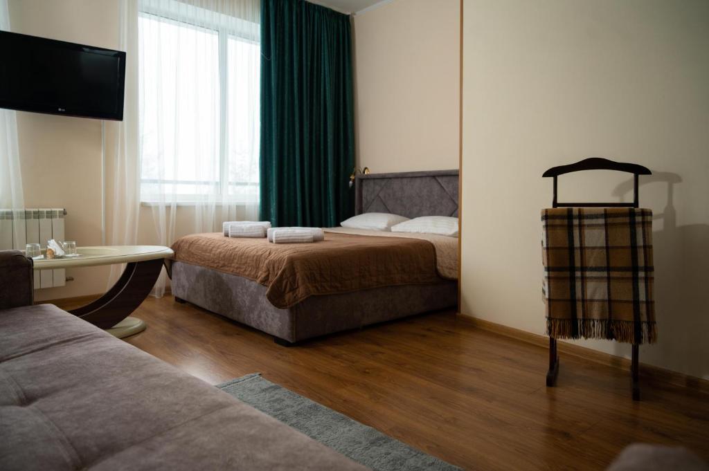 Postel nebo postele na pokoji v ubytování Kamyanka