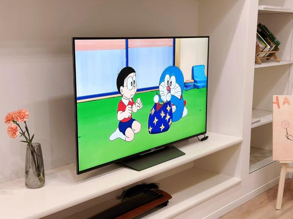 TV a/nebo společenská místnost v ubytování 和悦岸里玉出