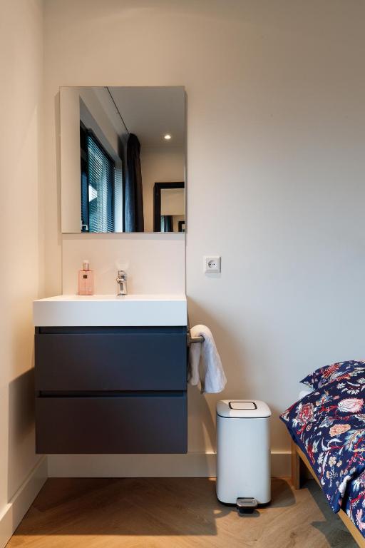 Postel nebo postele na pokoji v ubytování Easy Sleep Lelystad