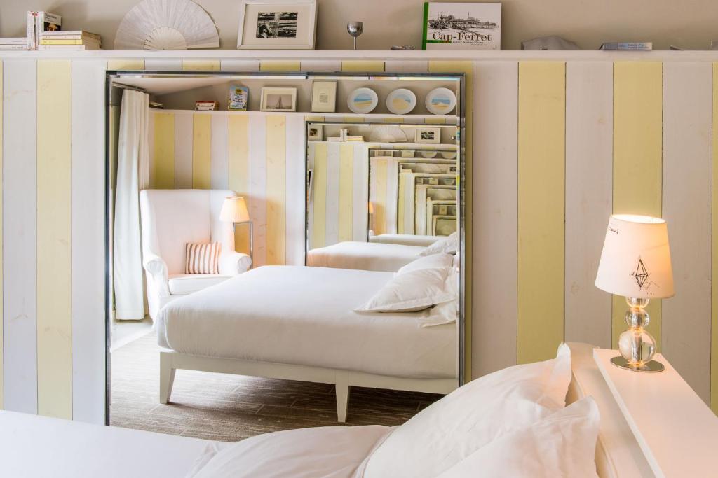 Postel nebo postele na pokoji v ubytování Hotel La Co(o)rniche