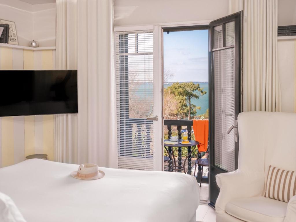 Postel nebo postele na pokoji v ubytování Hotel La Co(o)rniche