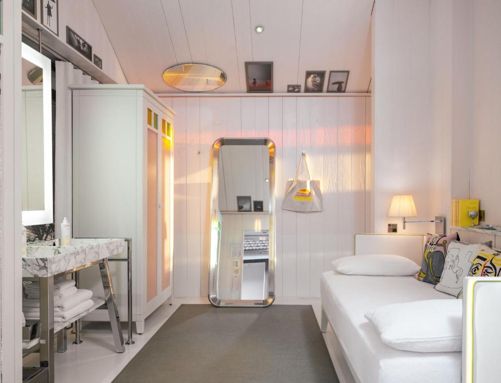Postel nebo postele na pokoji v ubytování Hotel La Co(o)rniche
