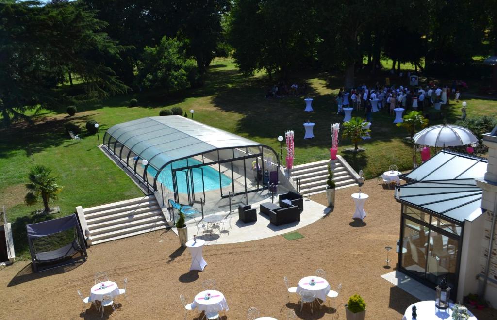 an overhead view of a building with a pool at Le Domaine du Chêne Vert in Château-Gontier