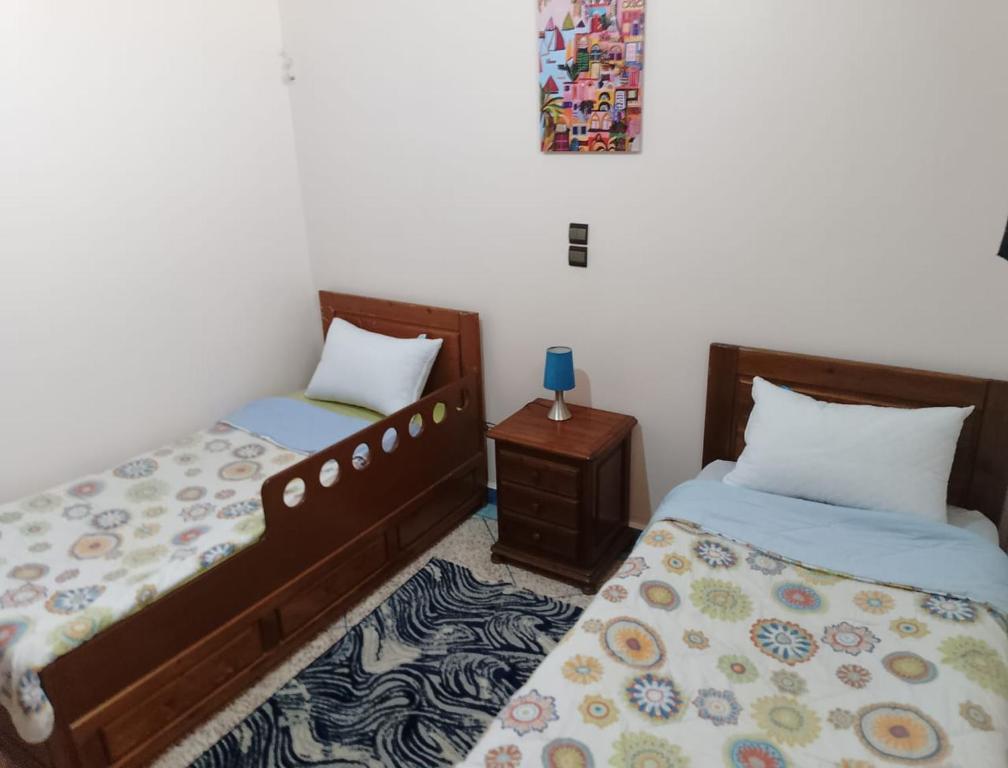 Postel nebo postele na pokoji v ubytování appartement de vacance Aourir2