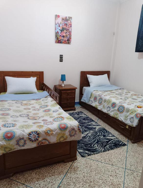 Postel nebo postele na pokoji v ubytování appartement de vacance Aourir2