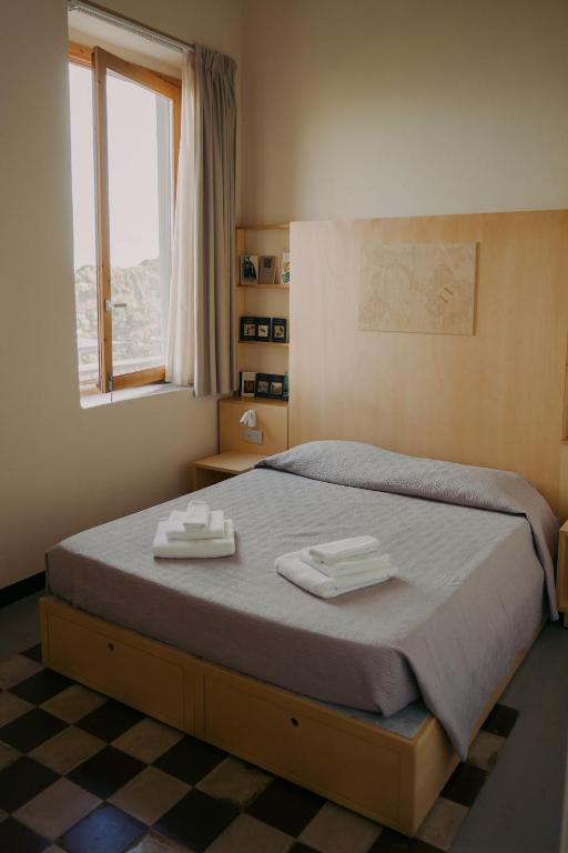 Voodi või voodid majutusasutuse Rifugio di Mare toas