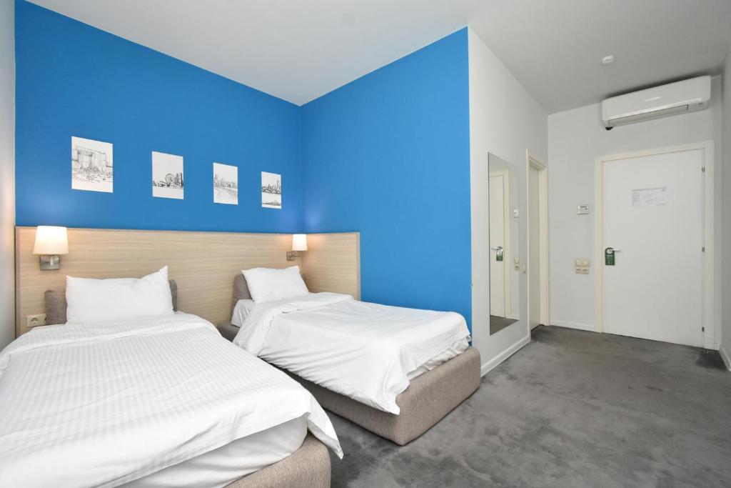 Postel nebo postele na pokoji v ubytování Hotel In City