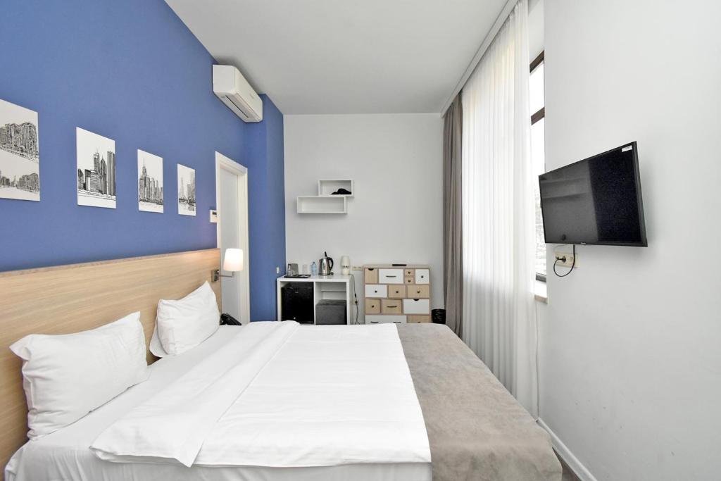 Postel nebo postele na pokoji v ubytování Hotel In City