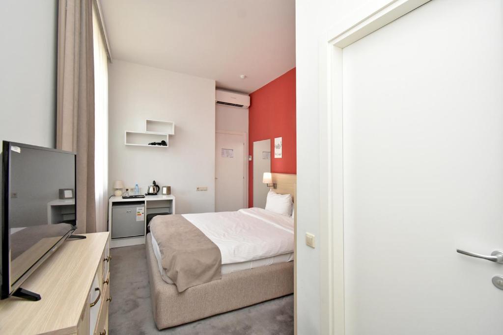 Postel nebo postele na pokoji v ubytování Hotel In City