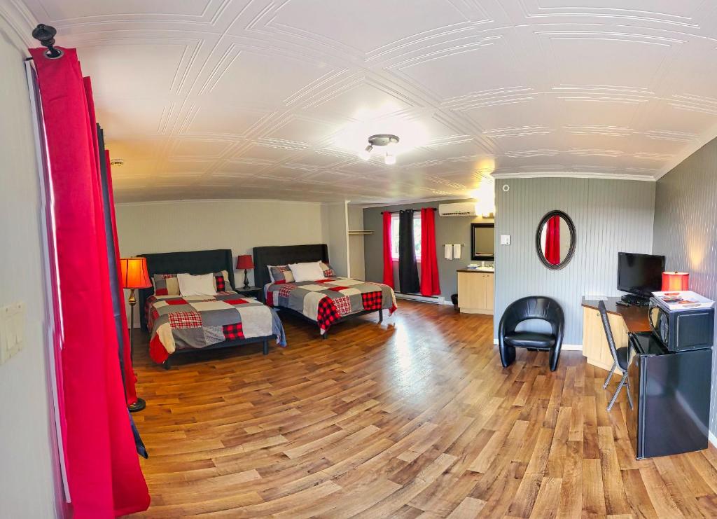 Postel nebo postele na pokoji v ubytování Motel Au Vieux Frontenac