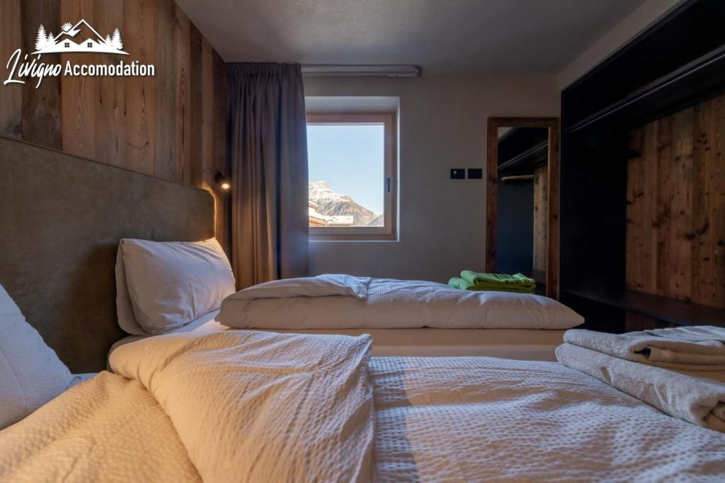 Posteľ alebo postele v izbe v ubytovaní Chalet 1816 by Livigno Accomodation