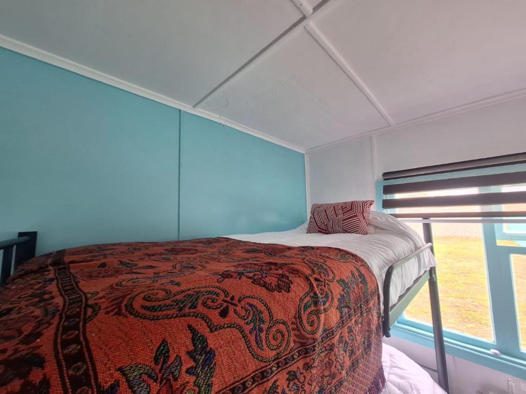 Postel nebo postele na pokoji v ubytování Hostel Kuntur