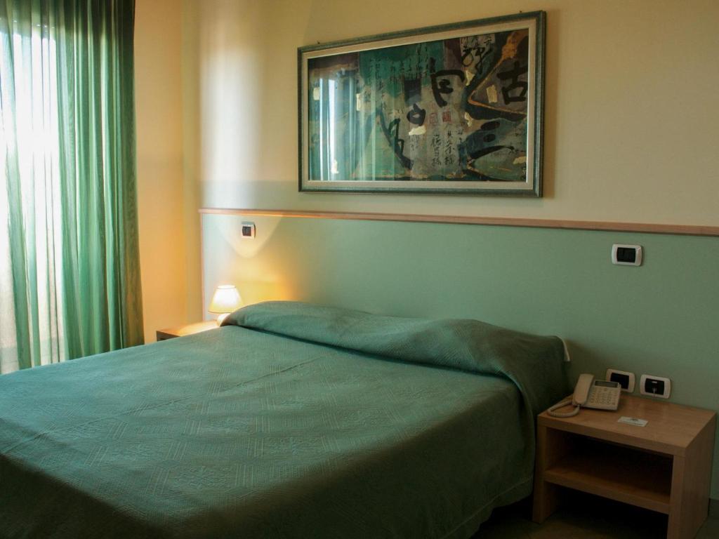 Posteľ alebo postele v izbe v ubytovaní Blu Hotel