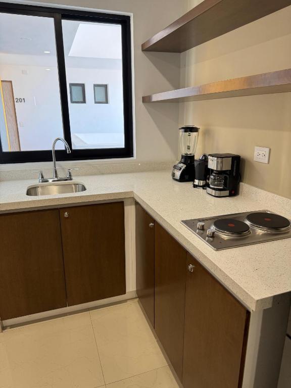 A cozinha ou kitchenette de Hotel Faava