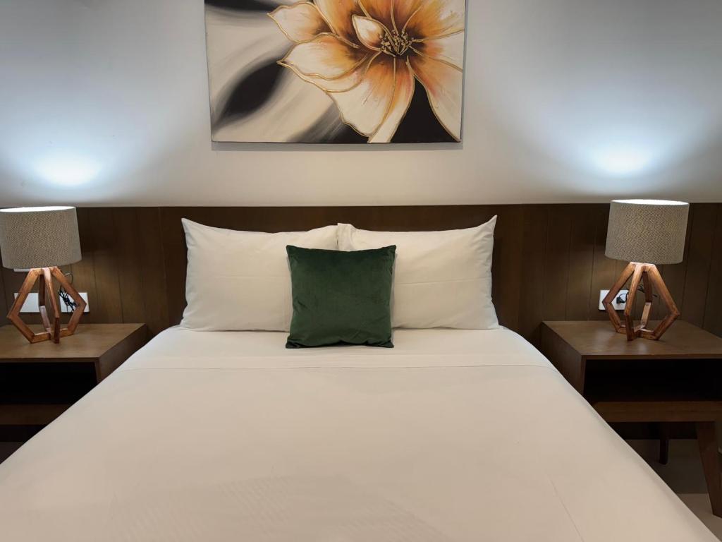 Uma cama ou camas num quarto em Hotel Faava