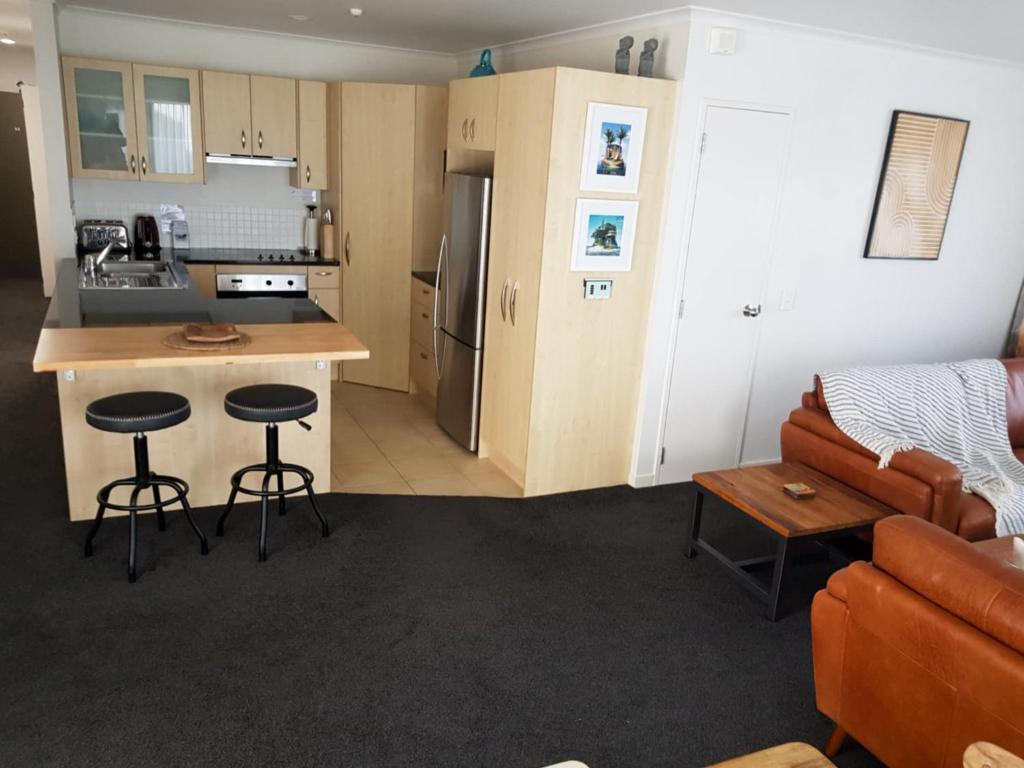 Kuchyň nebo kuchyňský kout v ubytování Ocean Breeze Resort Pauanui