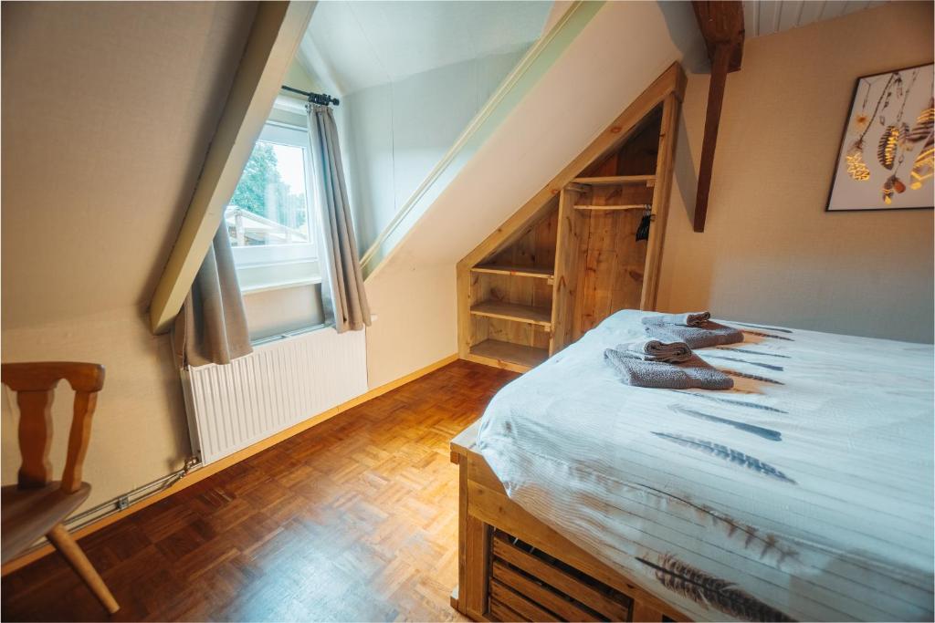 Postel nebo postele na pokoji v ubytování De Holsterhoeve