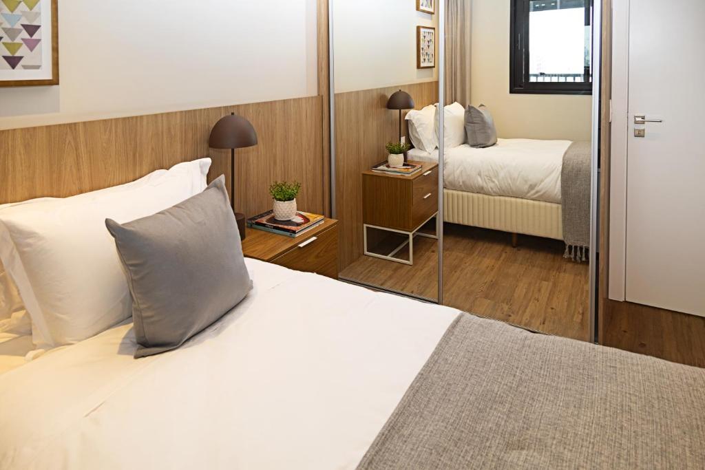 Ένα ή περισσότερα κρεβάτια σε δωμάτιο στο Expand 2958 - Pinheiros