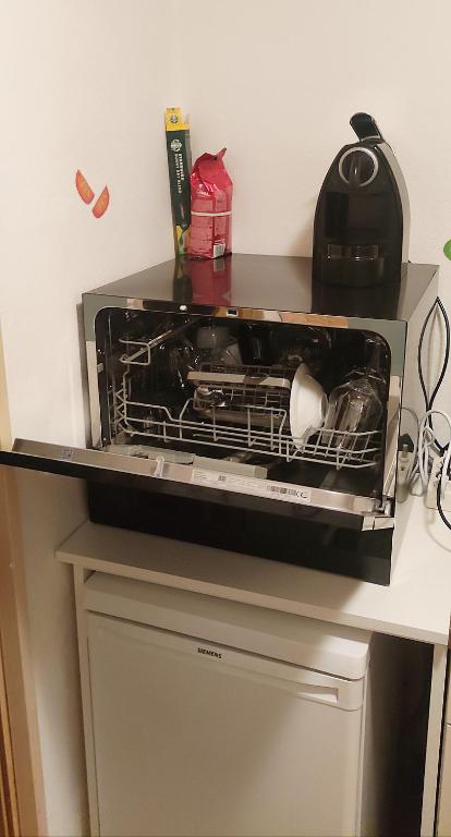 A kitchen or kitchenette at Apartment Alena - include Jokercard