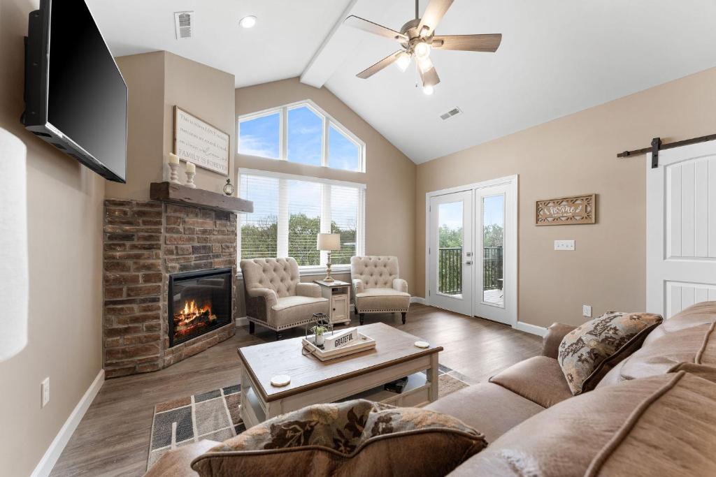 a living room with a couch and a fireplace at Spacious Retreat, Heart of the City, Indoor Pool, Free Attraction Tickets! in Branson