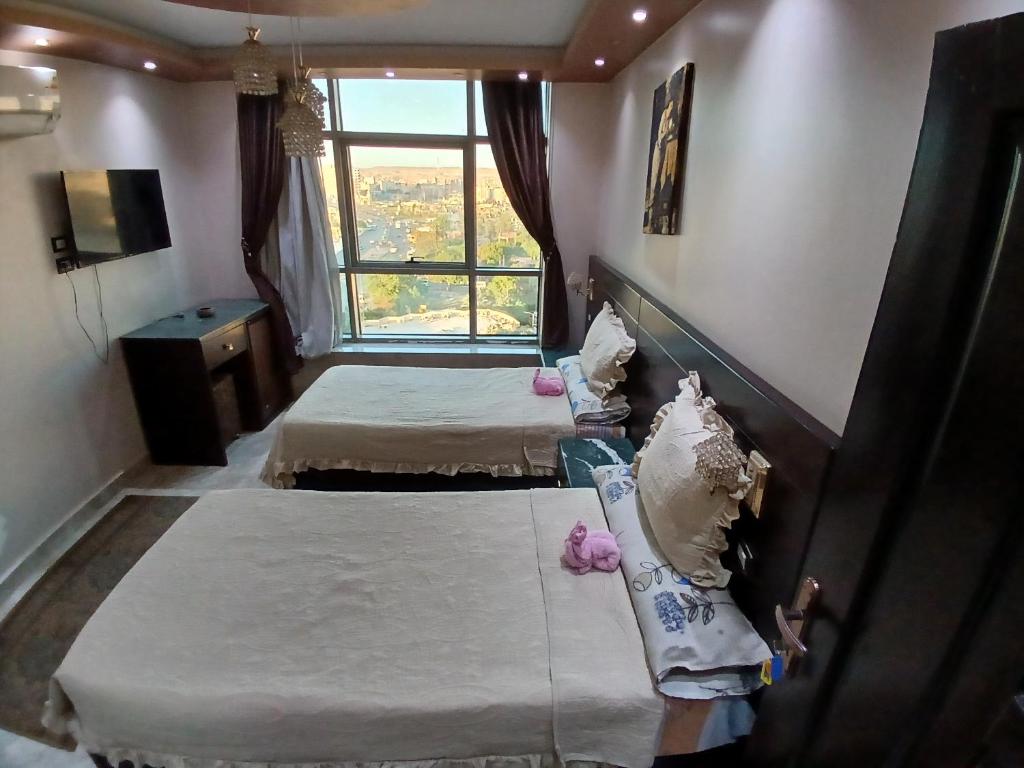Postel nebo postele na pokoji v ubytování Monty Homestay