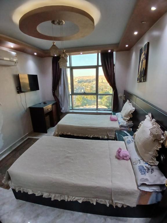 Postel nebo postele na pokoji v ubytování Monty Homestay