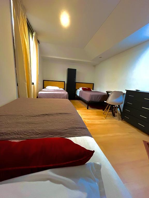 Voodi või voodid majutusasutuse Hostal Amanari toas