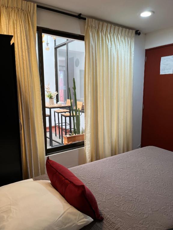 Voodi või voodid majutusasutuse Hostal Amanari toas