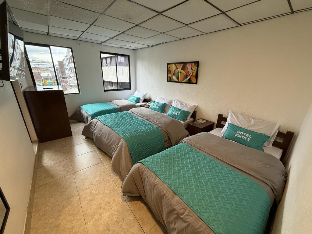 Postel nebo postele na pokoji v ubytování Hotel Suite Centro Bogotá