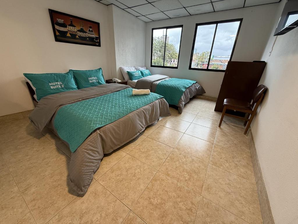 Postel nebo postele na pokoji v ubytování Hotel Suite Centro Bogotá