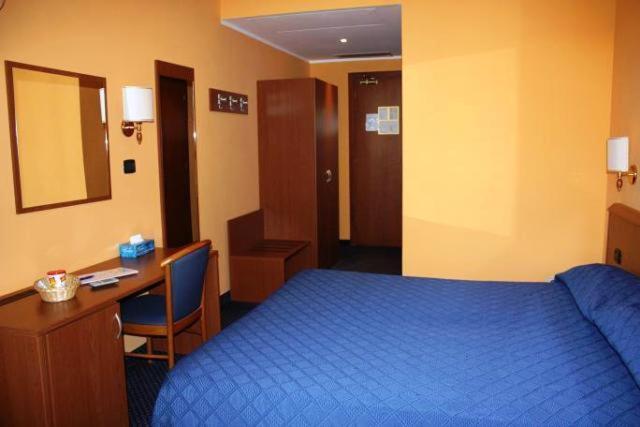 Postel nebo postele na pokoji v ubytování Hotel Tre Denti