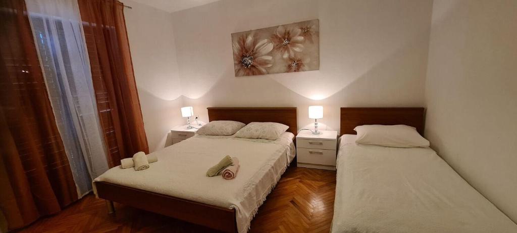 Posteľ alebo postele v izbe v ubytovaní Apartments DaRi
