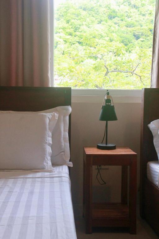 Postel nebo postele na pokoji v ubytování Lakandiwa Tourist Inn
