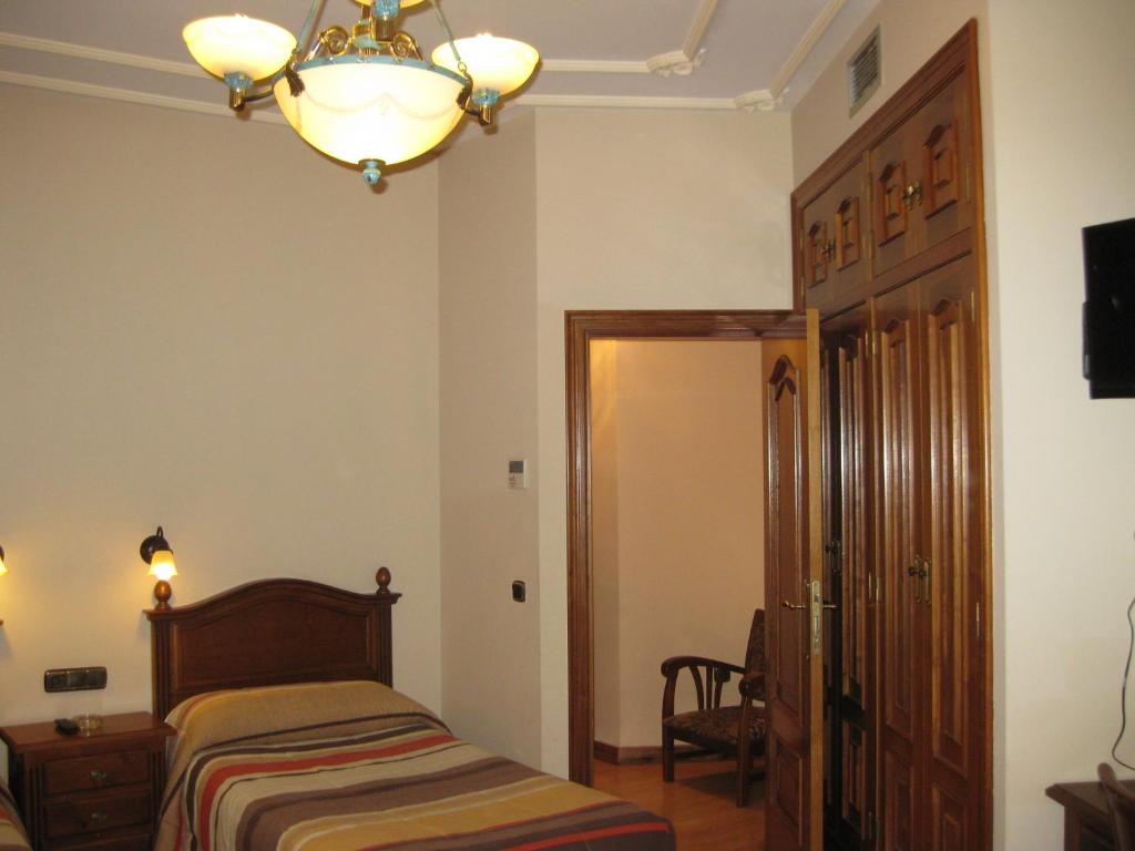 Voodi või voodid majutusasutuse Hostal Granada toas
