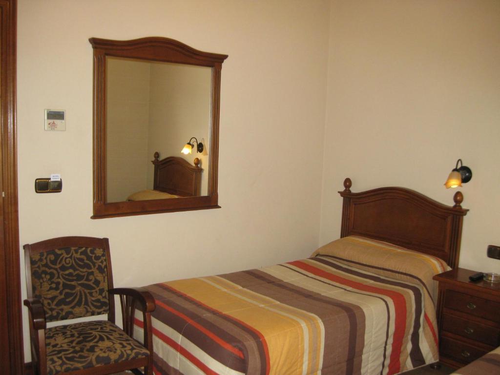 Voodi või voodid majutusasutuse Hostal Granada toas