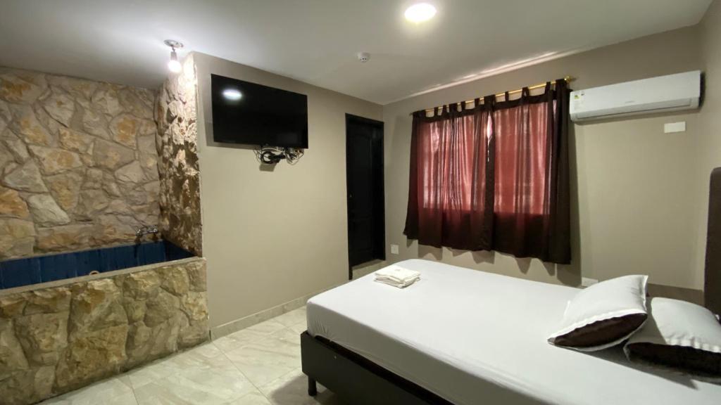 TV a/nebo společenská místnost v ubytování Hostal Bellagio