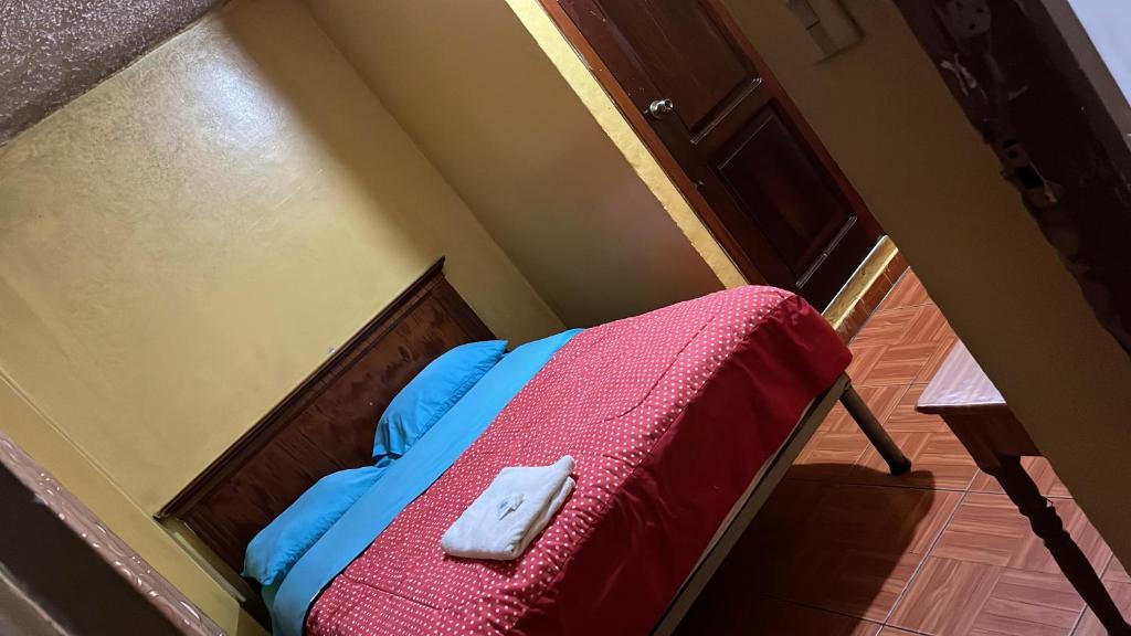 Postel nebo postele na pokoji v ubytování Hotel Residencial Miraflores