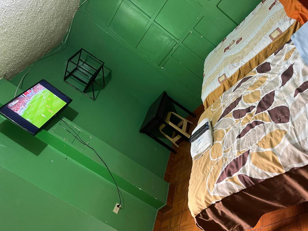 Postel nebo postele na pokoji v ubytování Hotel Residencial Miraflores