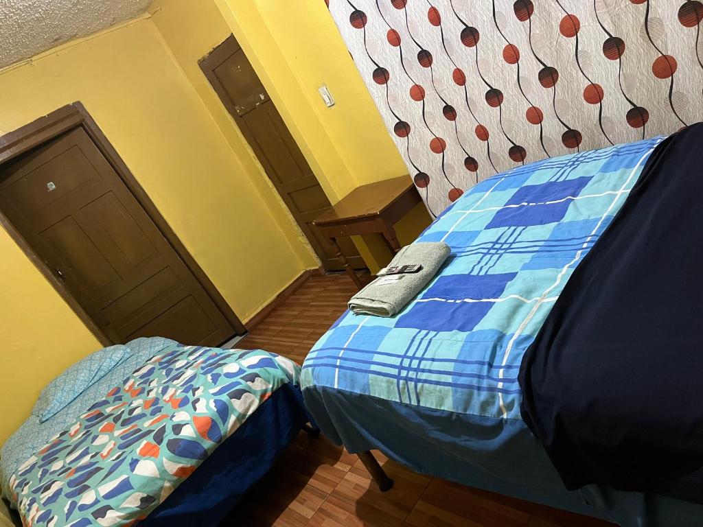 Postel nebo postele na pokoji v ubytování Hotel Residencial Miraflores