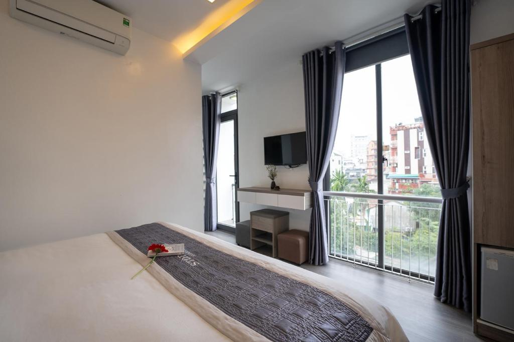 Giường trong phòng chung tại Stop and Go Boutique Homestay Hue