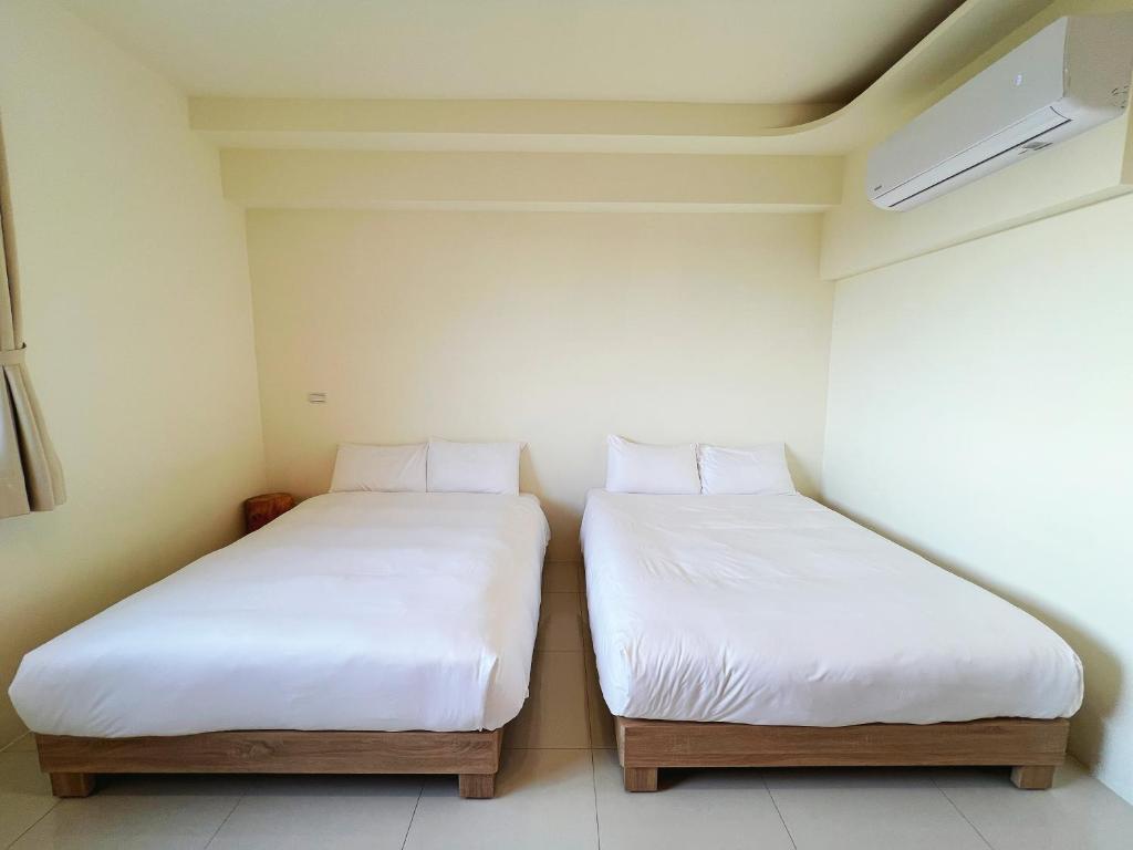 Postel nebo postele na pokoji v ubytování 日子有光 SHINE Inn Day