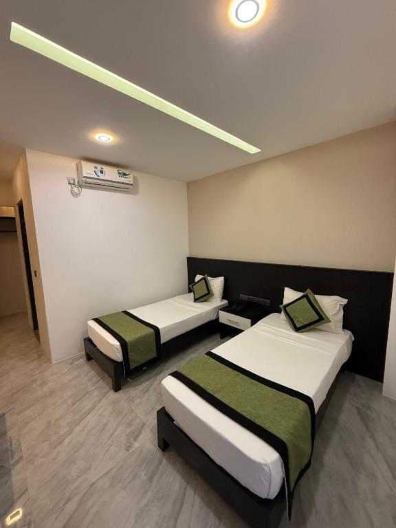 Postel nebo postele na pokoji v ubytování Ruvisha Beach Hotel