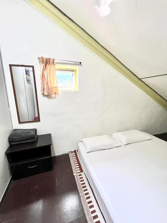 Postel nebo postele na pokoji v ubytování De Cameron Guest House