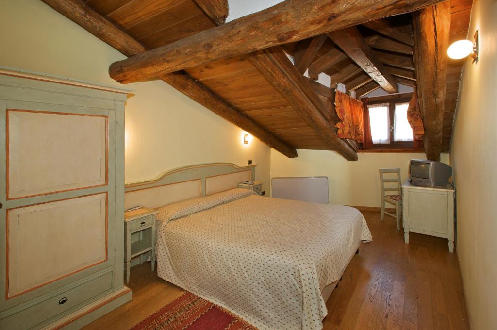 Postel nebo postele na pokoji v ubytování Hotel Chez Toi