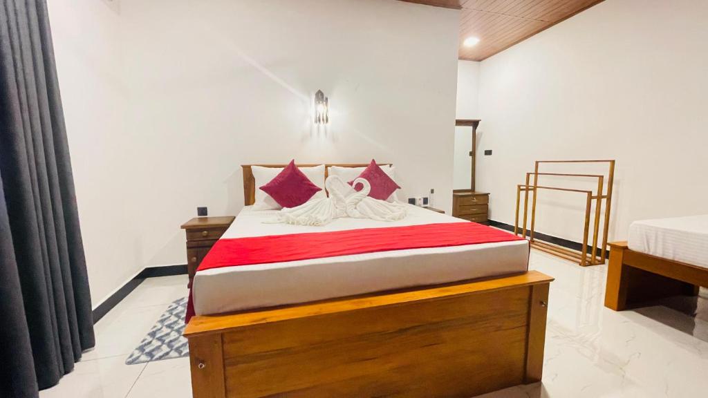 Postel nebo postele na pokoji v ubytování Sigiri Delight Holiday home