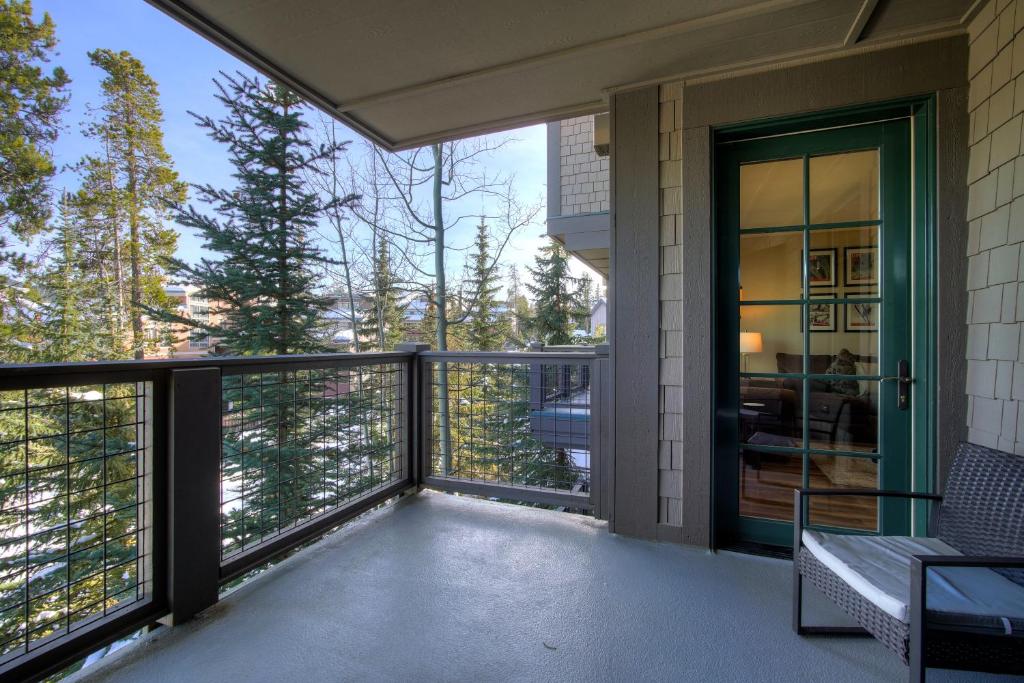 a balcony of a house with a glass door at Cozy Ski Chalet with Large Balcony condo in Breckenridge
